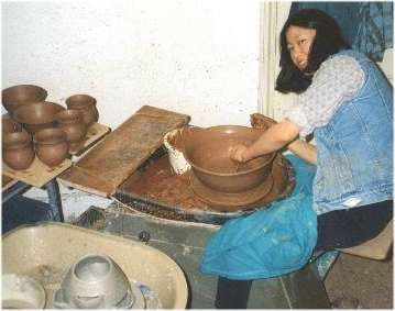 Shirley Stewart throwing pots on the wheel